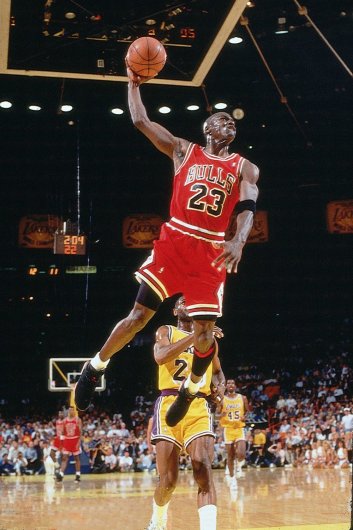 INGLEWOOD, CA - JUNE 12:  Michael Jordan #23 of the Chicago Bulls goes for a dunk against the Los Angeles Lakers in game five of the 1991 NBA Finals on June 12, 1991 at the Great Western Forum in Inglewood, California. The Bulls won 108-101 NOTE TO USER: User expressly acknowledges and agrees that, by downloading and or using this Photograph, user is consenting to the terms and conditions of the Getty Images License Agreement. Mandatory Copyright Notice: Copyright 1991 NBAE (Photo by Andrew D. Bernstein/NBAE via Getty Images)